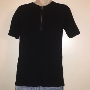 Basic black tee with classy upgrades. Size XS.
